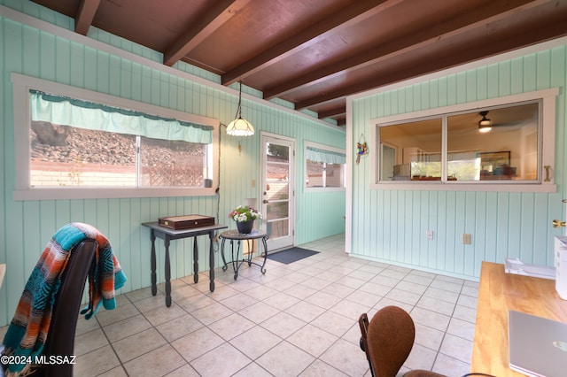 sunroom with beam ceiling