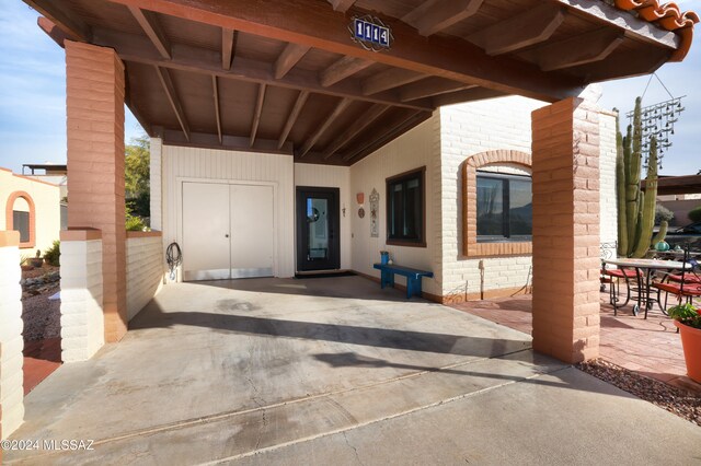 property entrance with a patio