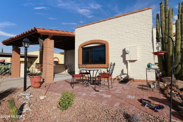 rear view of property featuring a patio area