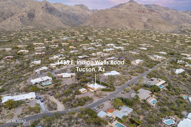 aerial view at dusk with a mountain view