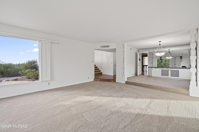 unfurnished living room with carpet floors