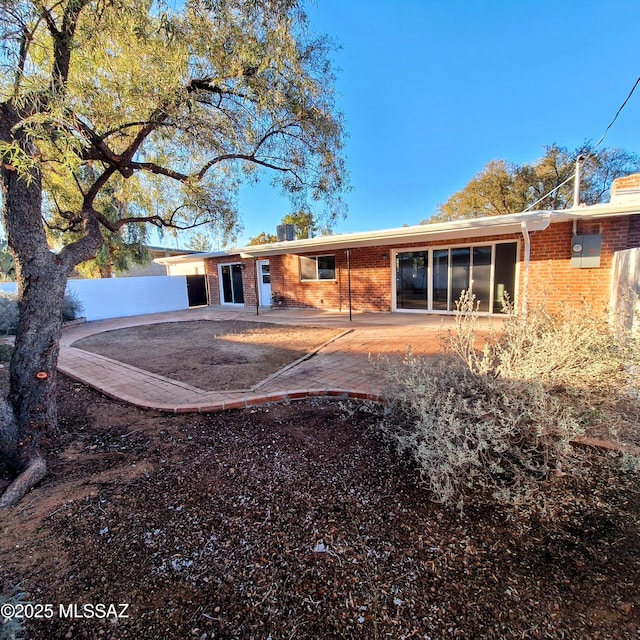 back of property featuring a patio