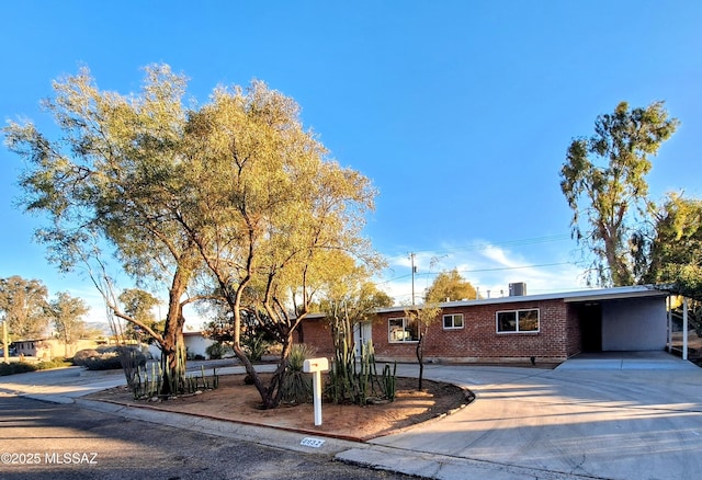 ranch-style house with a carport