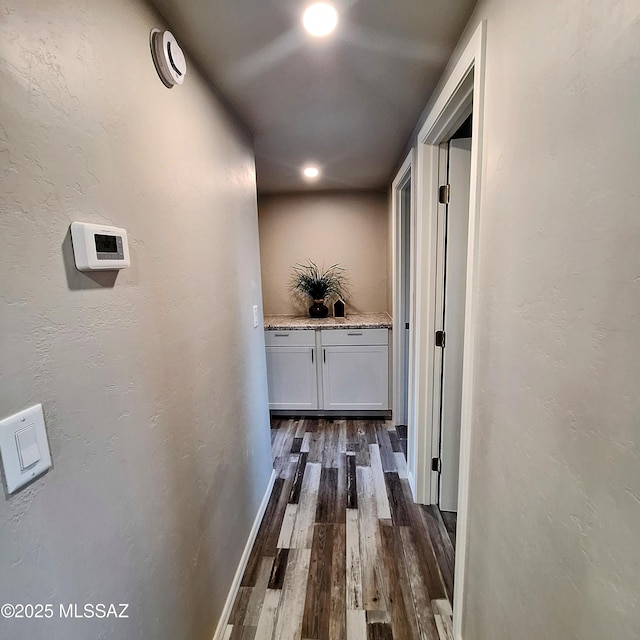 hallway featuring dark hardwood / wood-style flooring