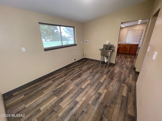 unfurnished room with dark hardwood / wood-style floors