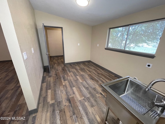 kitchen featuring lofted ceiling, sink, and dark hardwood / wood-style floors