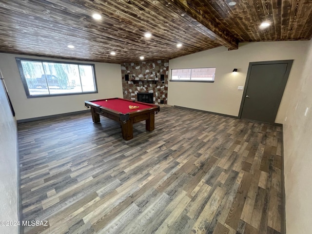 recreation room with vaulted ceiling with beams, a stone fireplace, dark hardwood / wood-style floors, wood ceiling, and pool table