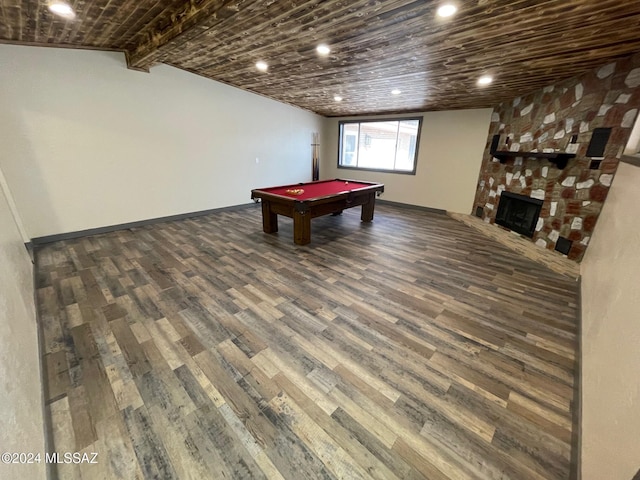 recreation room featuring a large fireplace, vaulted ceiling with beams, dark hardwood / wood-style flooring, and billiards