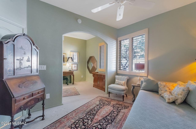 bedroom featuring ceiling fan and light colored carpet