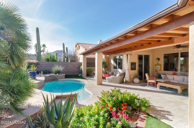 view of pool with outdoor lounge area and a patio