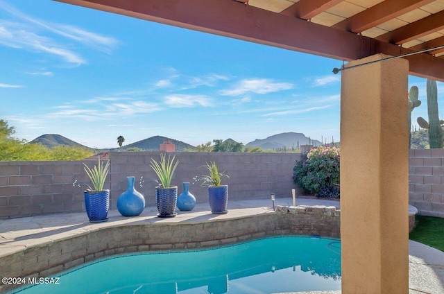 view of swimming pool featuring a mountain view