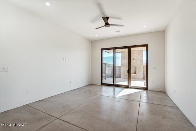 spare room featuring ceiling fan and french doors