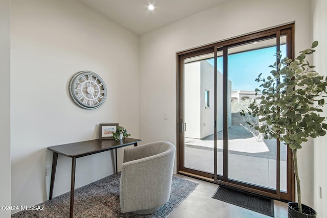 home office featuring concrete floors