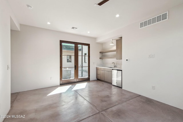 interior space with sink and french doors