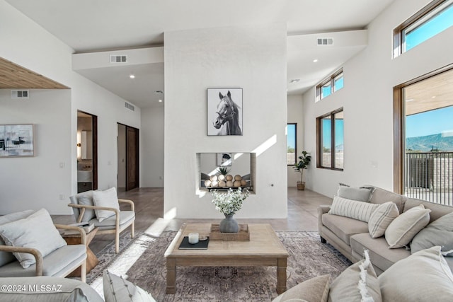 living room featuring a high ceiling