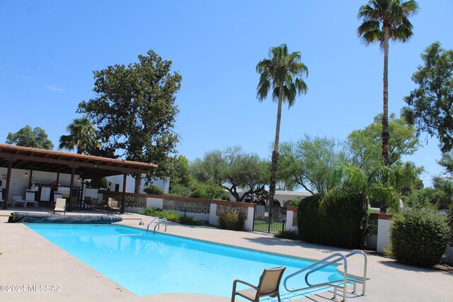 view of swimming pool featuring a patio