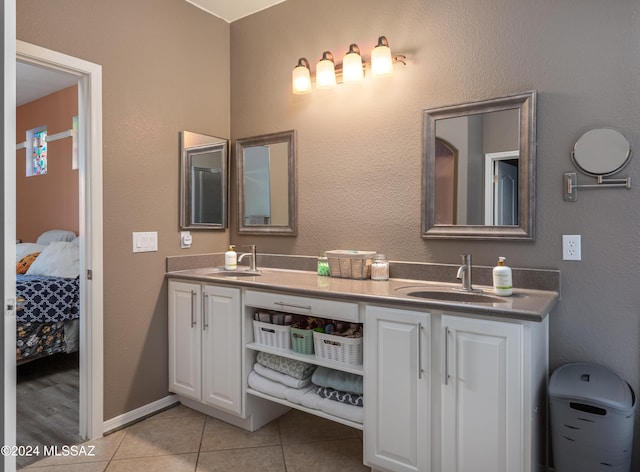 bathroom with tile patterned floors and vanity