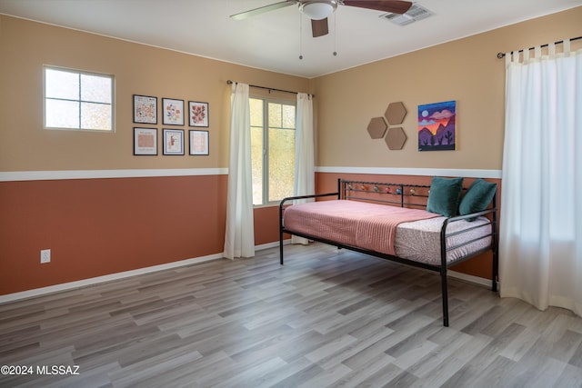 bedroom featuring ceiling fan and light hardwood / wood-style floors