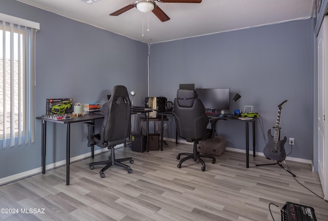 office area featuring light hardwood / wood-style flooring and ceiling fan