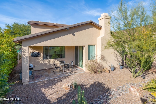 rear view of property with a patio