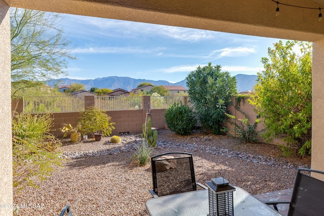 view of patio / terrace featuring a mountain view