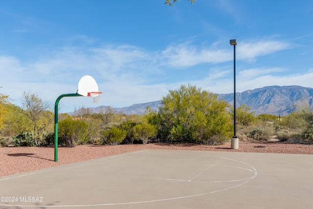 view of basketball court with a mountain view