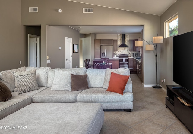 tiled living room with lofted ceiling