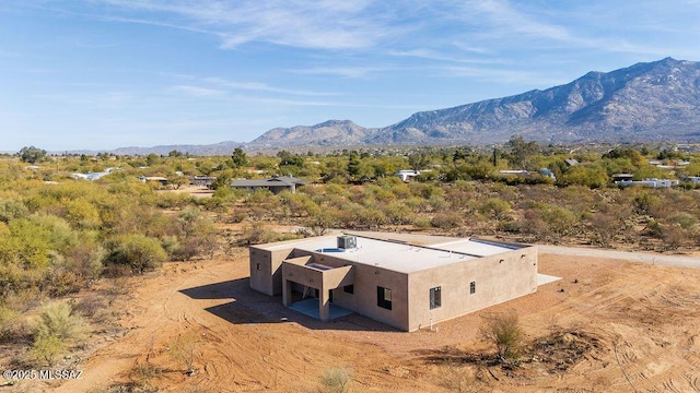 birds eye view of property featuring a mountain view