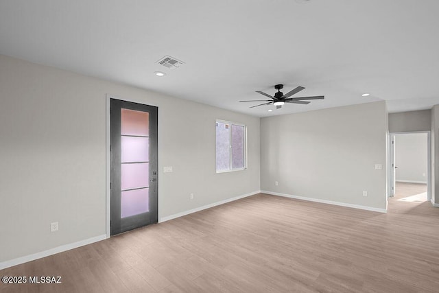 unfurnished room featuring ceiling fan and light hardwood / wood-style floors