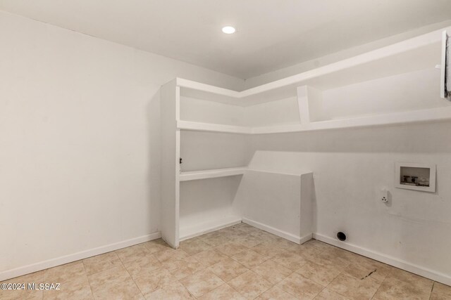 laundry area with hookup for an electric dryer, hookup for a washing machine, and hookup for a gas dryer