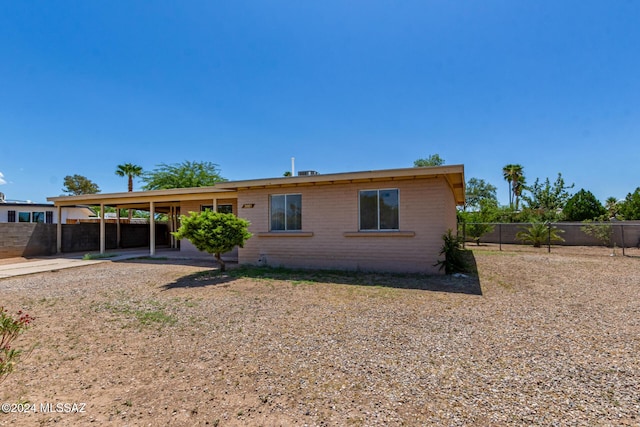 view of front of home with a carport