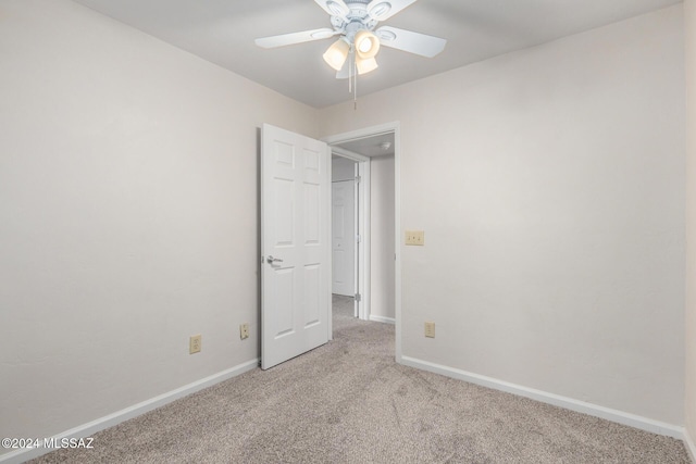 unfurnished bedroom with ceiling fan and light carpet