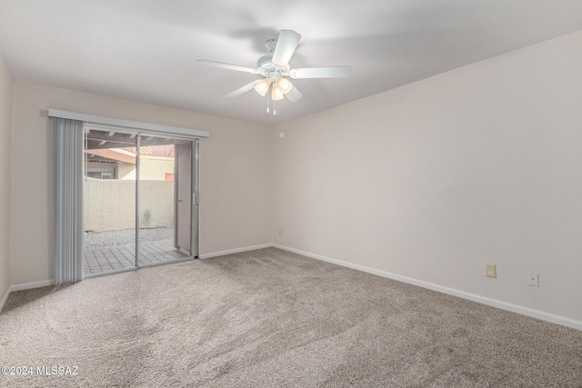 empty room with ceiling fan and carpet floors