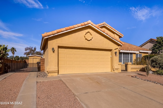 view of front of property with a garage