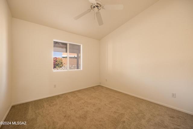 unfurnished room featuring carpet flooring, ceiling fan, and vaulted ceiling