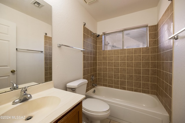 full bathroom with vanity, toilet, and tiled shower / bath