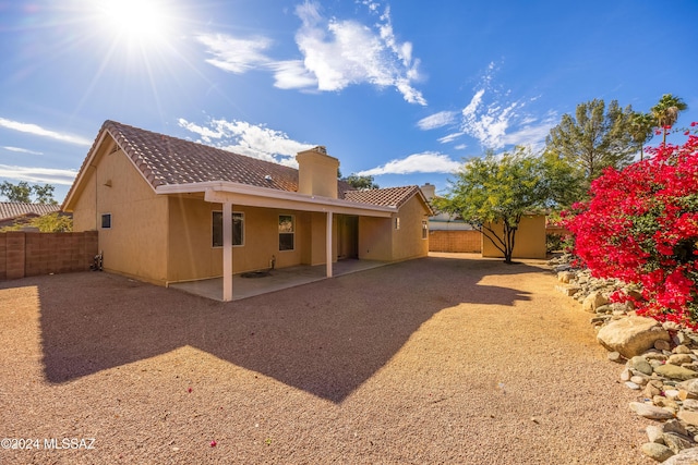 back of property featuring a patio