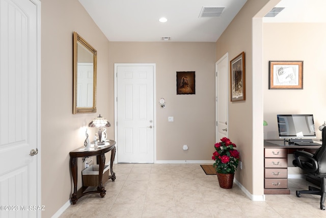 office area with light tile patterned flooring