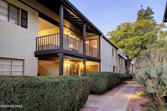 view of property exterior with a balcony