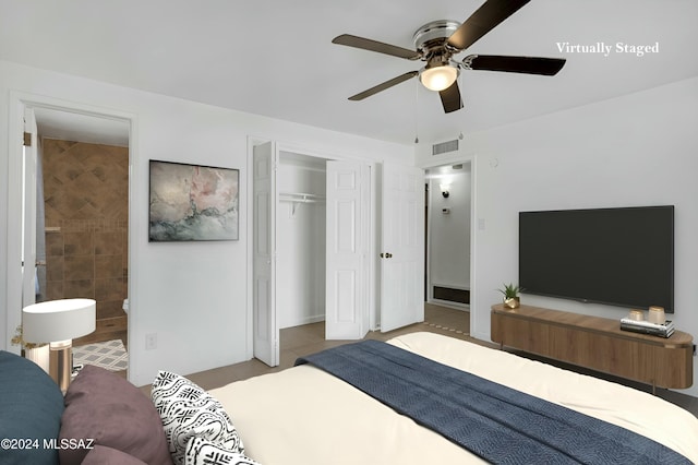 bedroom with connected bathroom, a closet, ceiling fan, and light tile patterned flooring