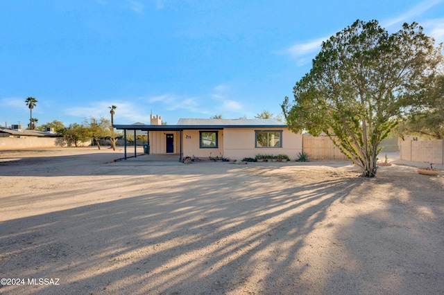 view of front of property with a carport