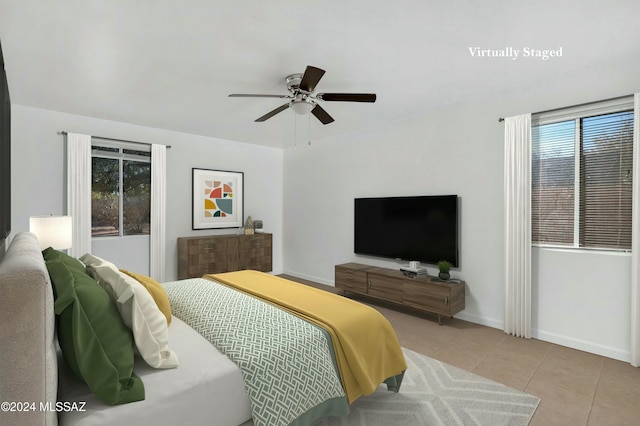 bedroom featuring ceiling fan and light tile patterned flooring