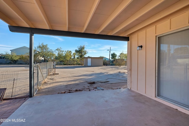 view of patio / terrace featuring a storage shed