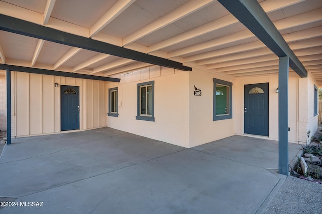 view of exterior entry with a porch