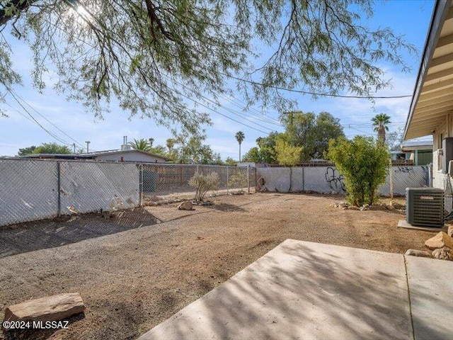 view of yard featuring a patio area and central AC