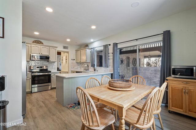 dining room featuring light hardwood / wood-style flooring