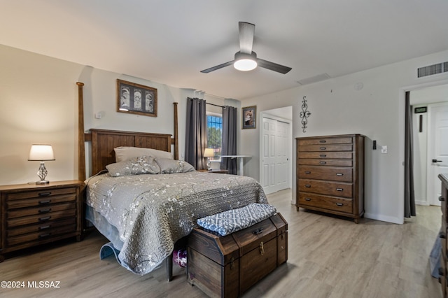 bedroom featuring a closet, ceiling fan, and light hardwood / wood-style flooring