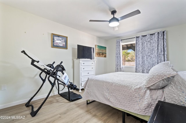 bedroom featuring ceiling fan and light hardwood / wood-style floors