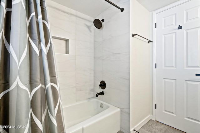 bathroom with shower / tub combo with curtain