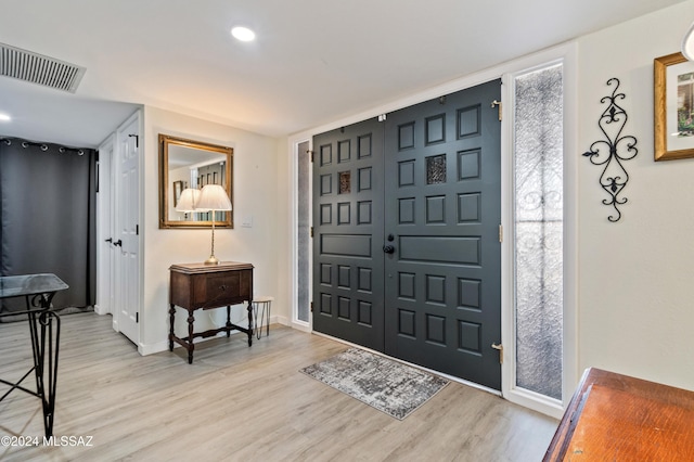 foyer with light wood-type flooring